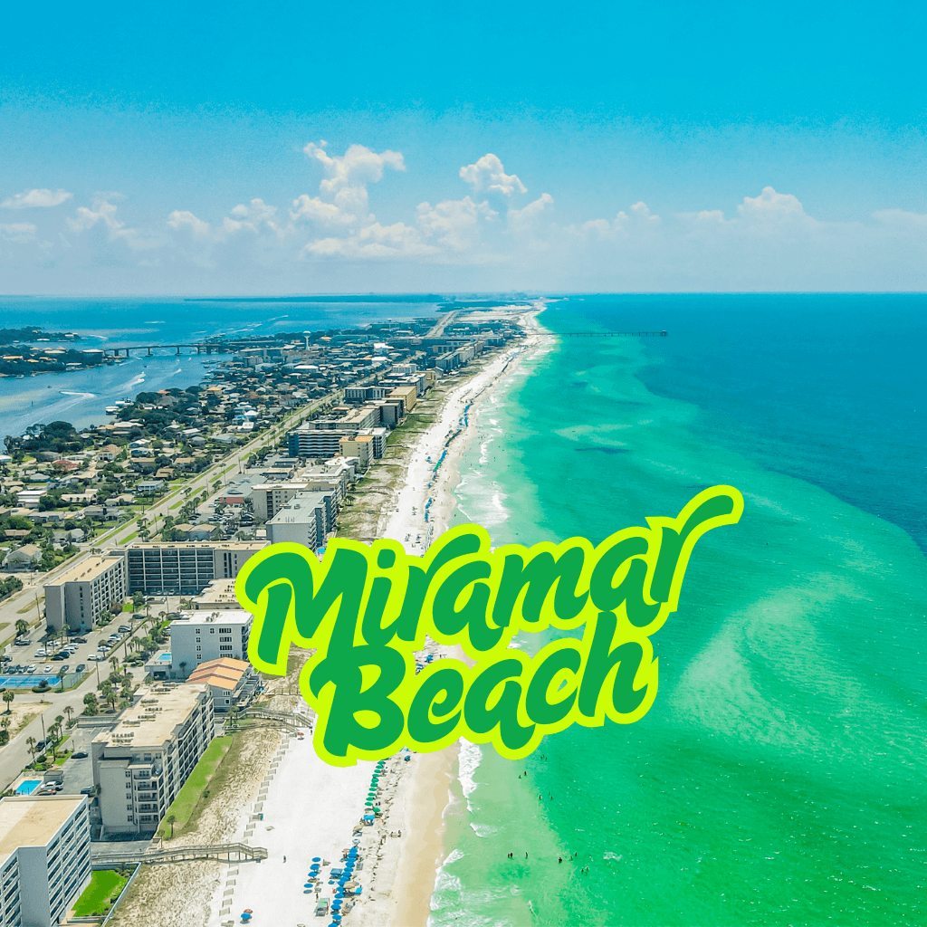 Miramar Beach Florida coastline with condos and emerald water aerial view