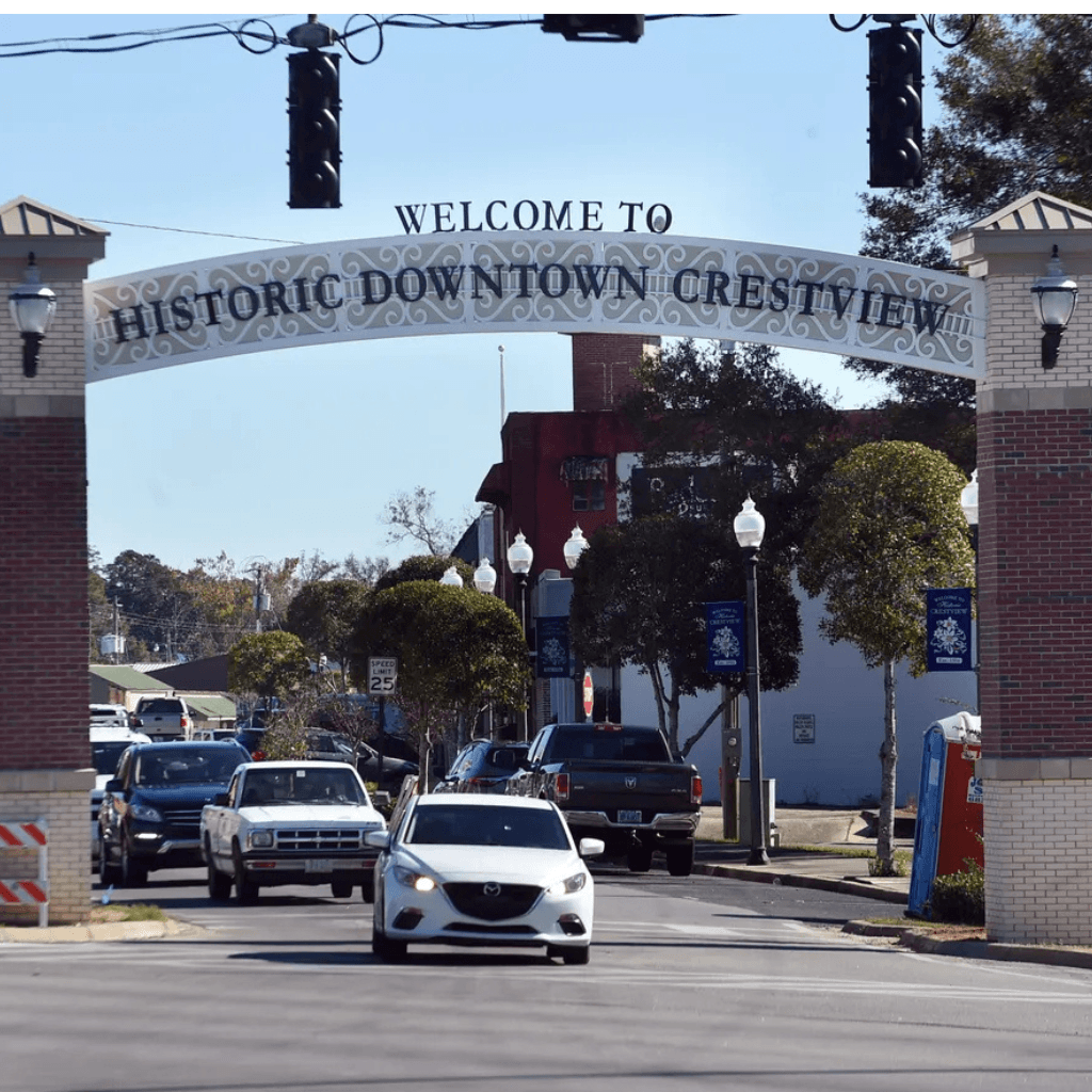 Historic downtown Crestview Florida welcome arch with street traffic