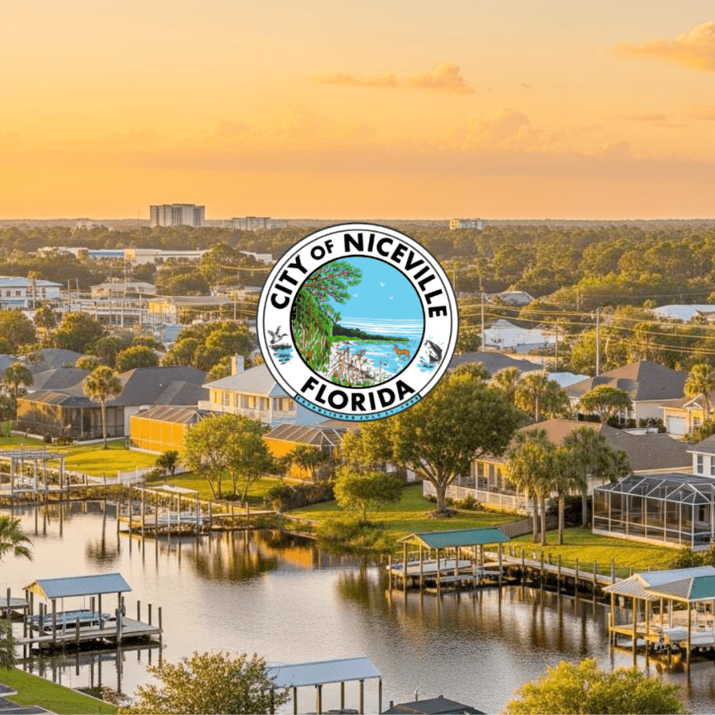 Niceville Florida waterfront homes with docks and bay view at sunset